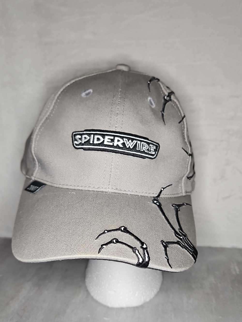 SpiderWire baseball cap featuring a logo patch and skeletal hand